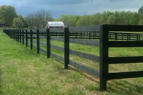Wood board farm fence on a Middle Tennessee pasture