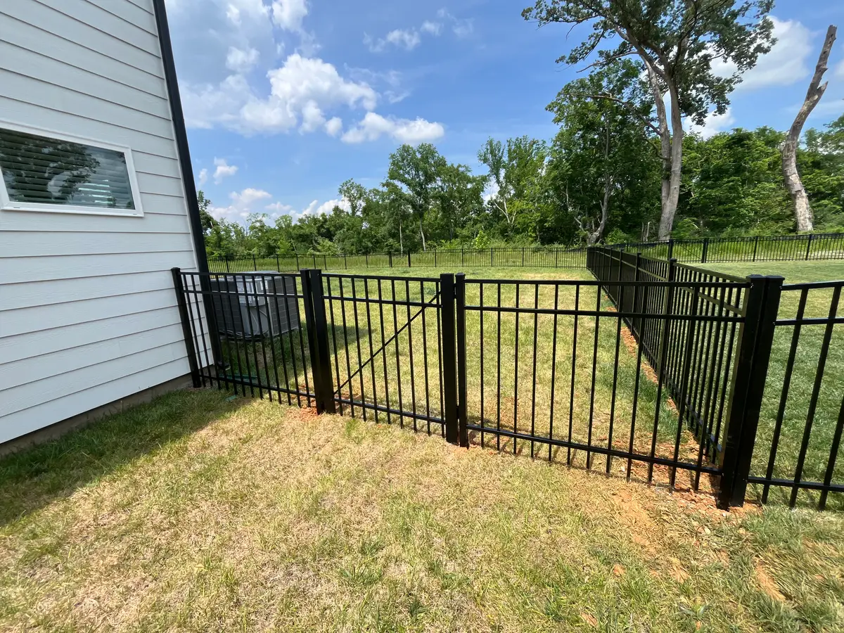 Black fence gate building entry detail, installed by Duck Duck Fence