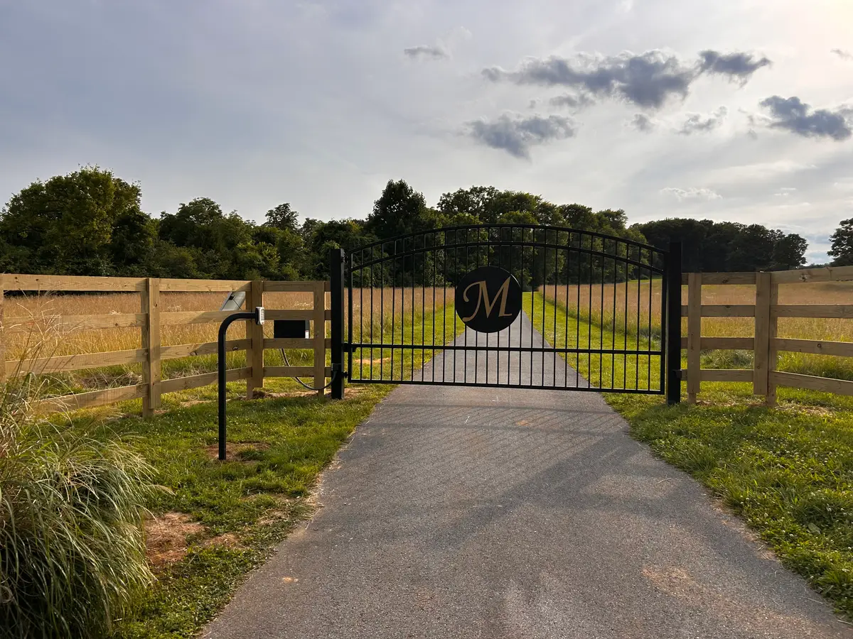 Wood privacy fence with a matching gated entry