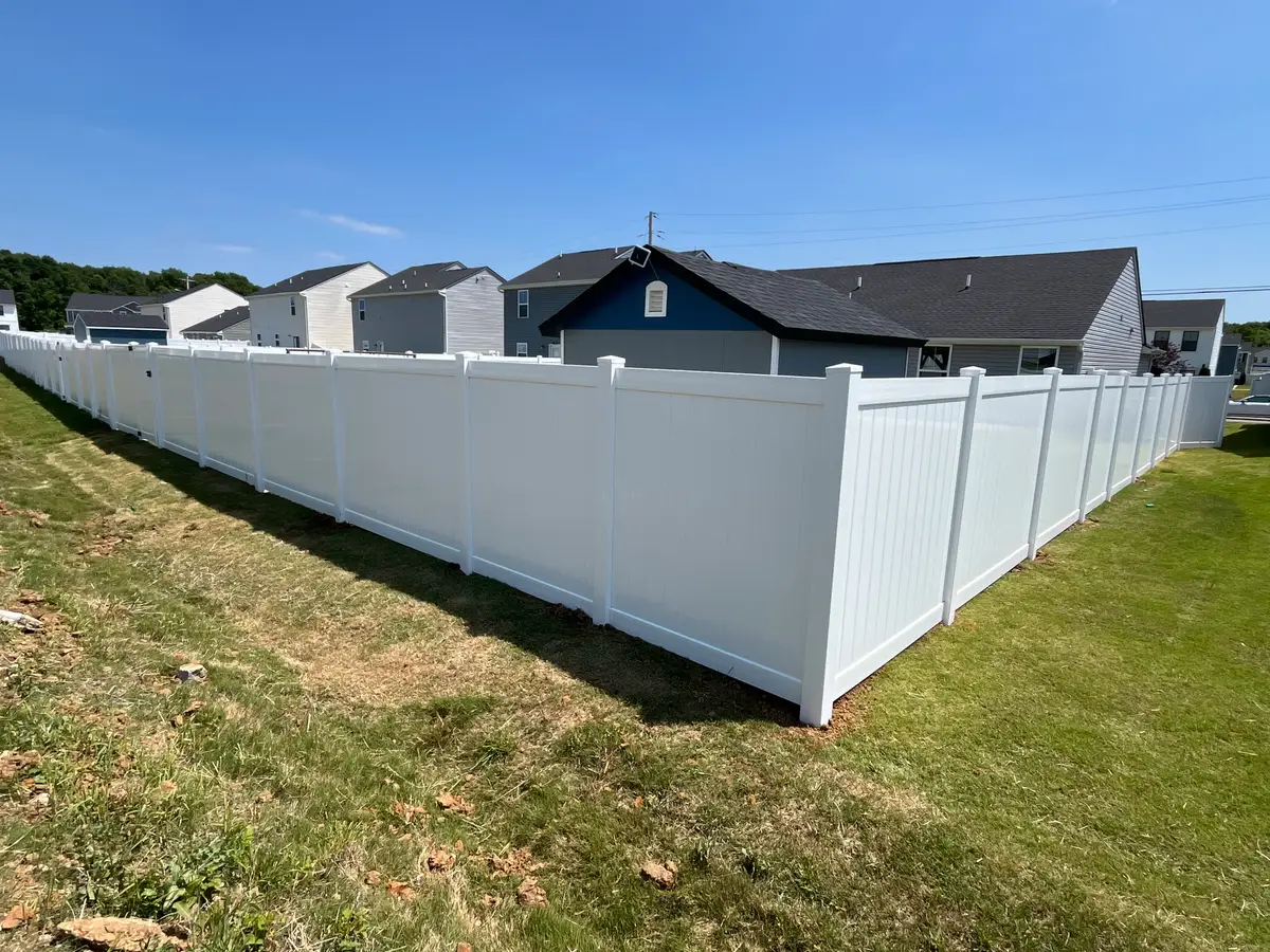 White vinyl privacy fence, installed by Duck Duck Fence