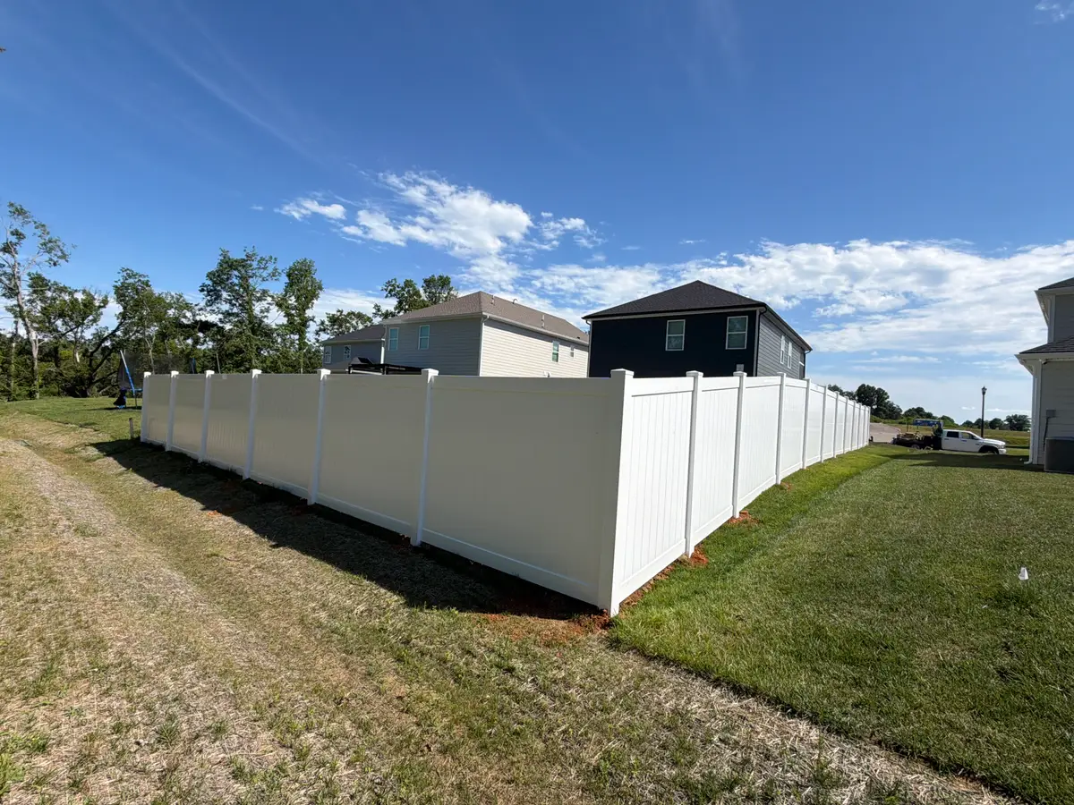 Large white vinyl privacy fence, installed by Duck Duck Fence