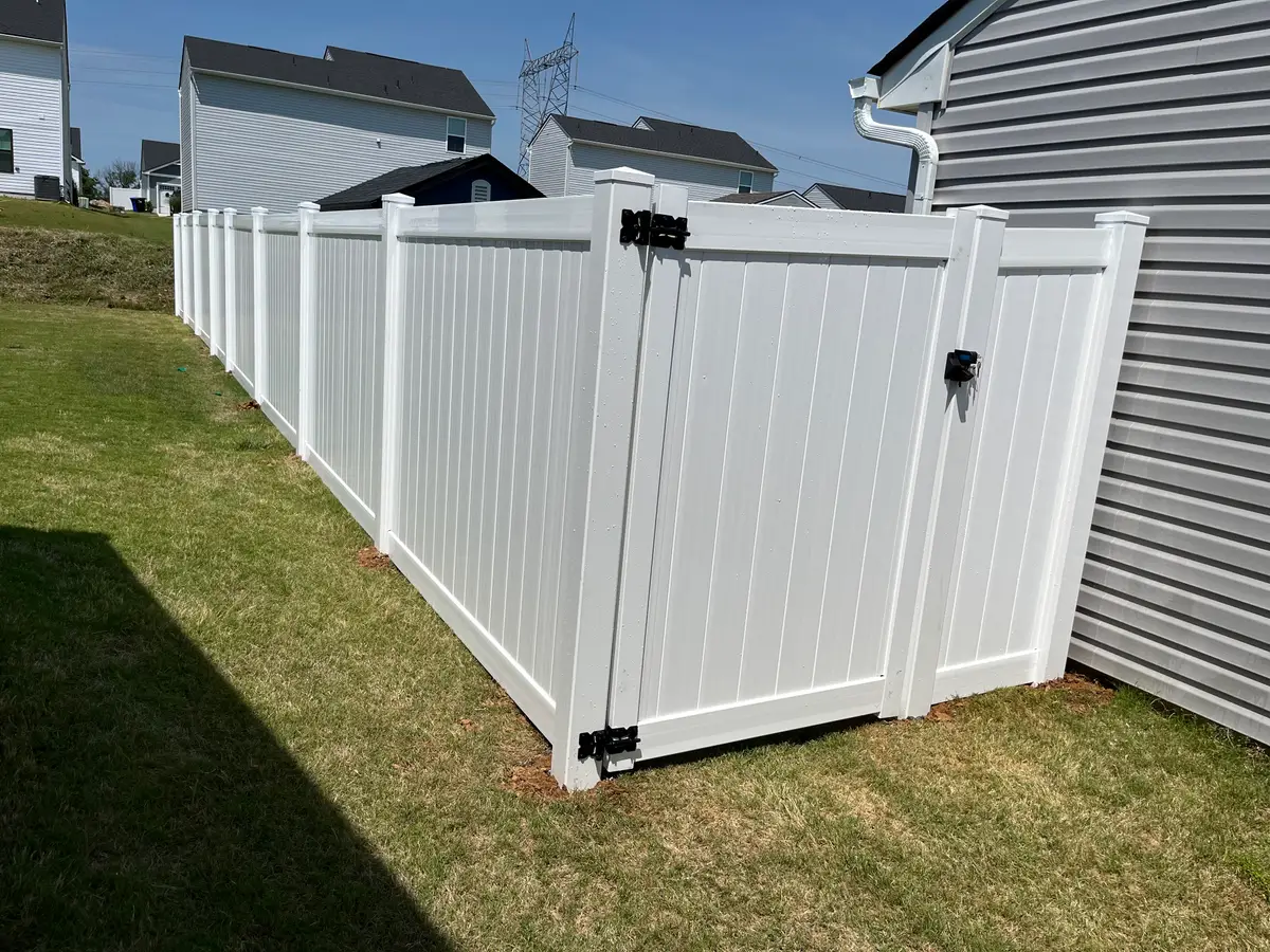 White vinyl fence with gate, installed by Duck Duck Fence