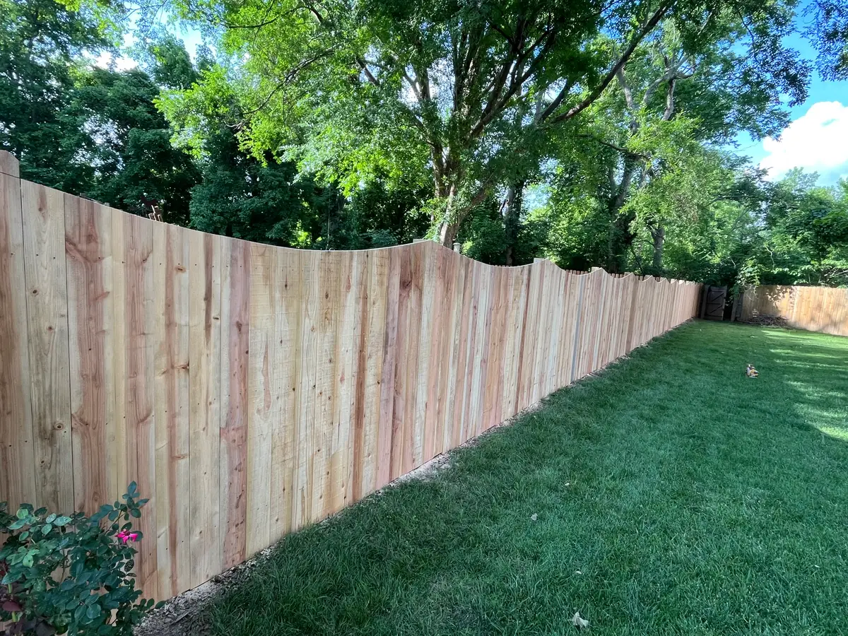 Wood privacy fence curved top detail, installed by Duck Duck Fence