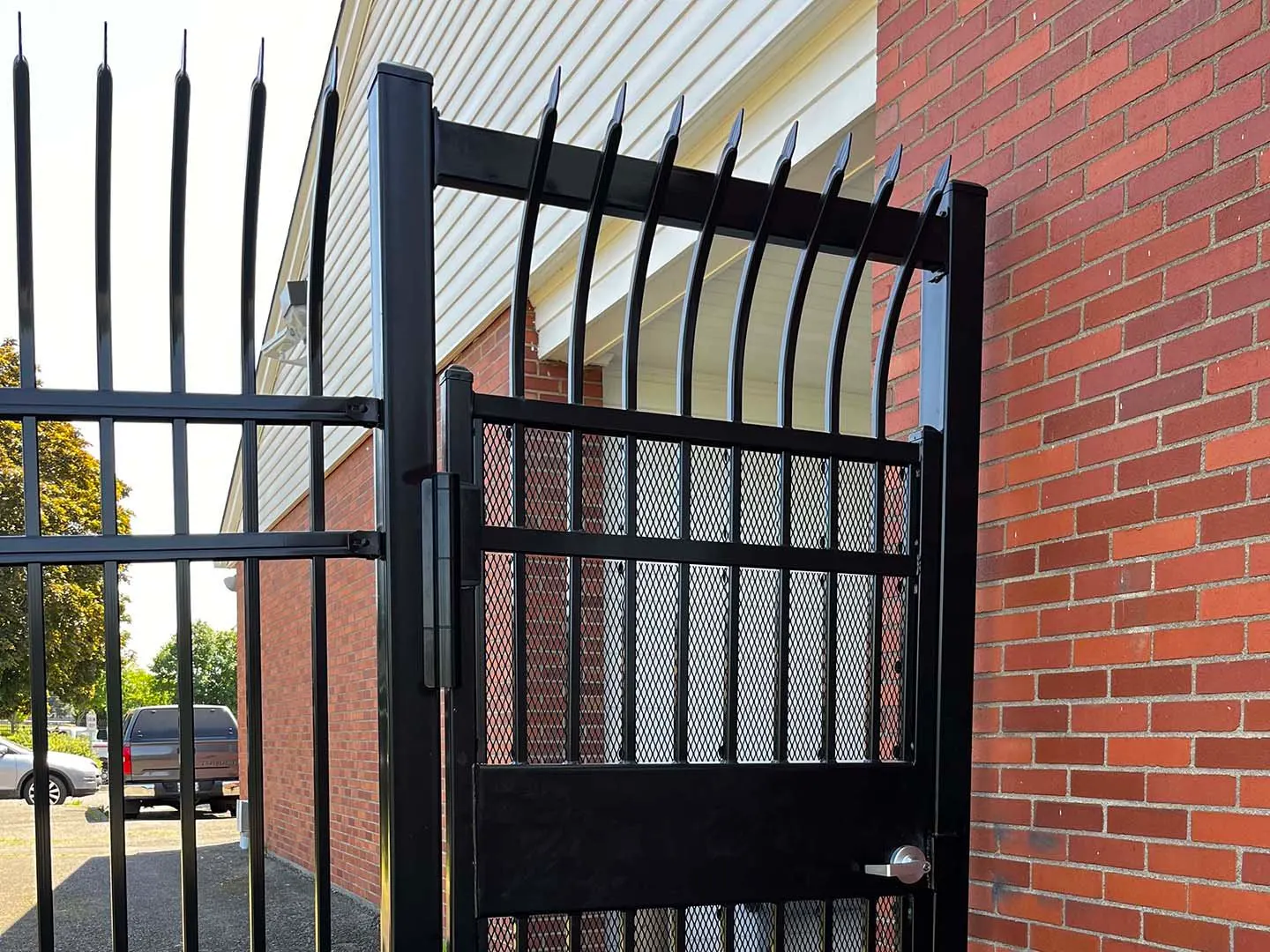 Motor court gate complementing a circular driveway