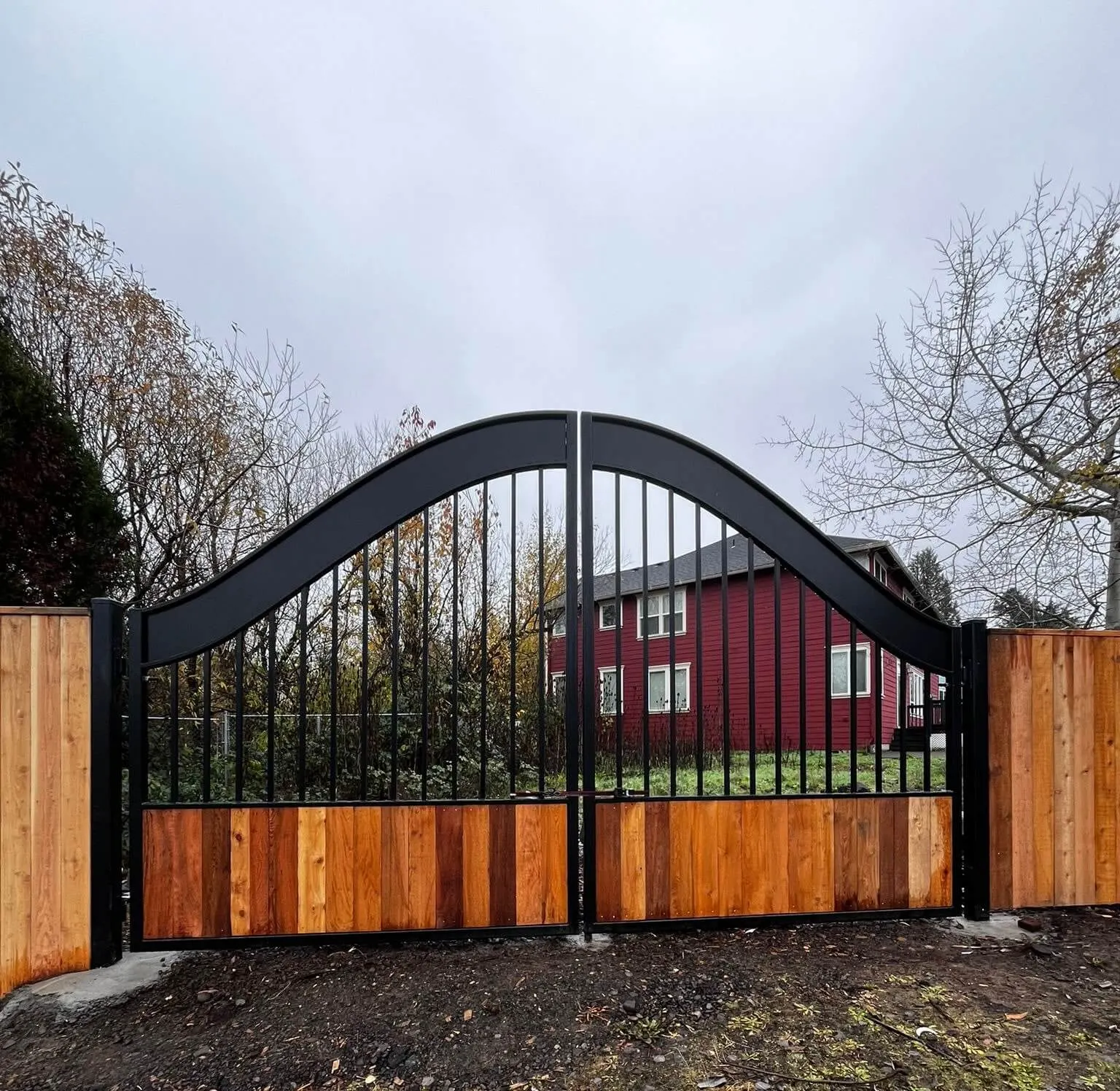 Custom residential wood gate matching a privacy fence